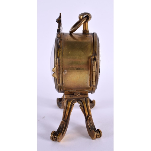 651 - AN EARLY 19TH CENTURY FRENCH GILT BRONZE MANTEL CLOCK upon scrolling rococo feet. 14 cm x 8 cm.