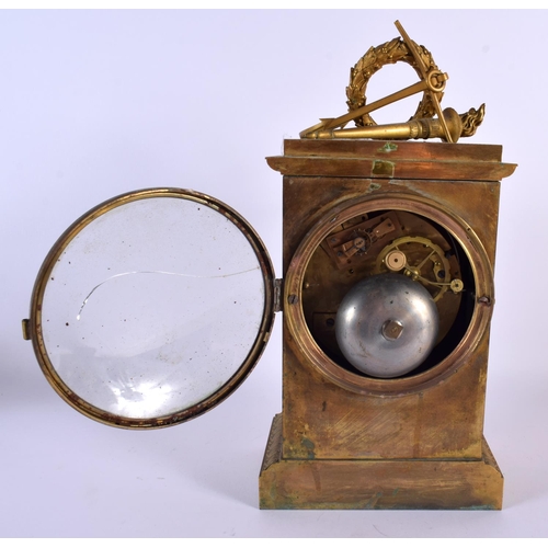 678 - AN EARLY 19TH CENTURY FRENCH ORMOLU MANTEL CLOCK decorated with overlaid trophies. 30 cm x 15 cm.