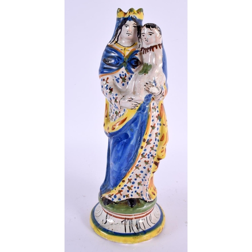 69 - A 19TH CENTURY FRENCH FAIENCE SAINT MARIE POTTERY FIGURE. 24 cm high.