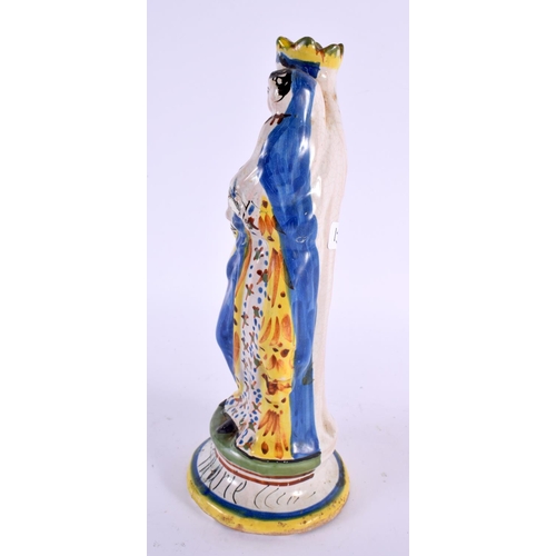 69 - A 19TH CENTURY FRENCH FAIENCE SAINT MARIE POTTERY FIGURE. 24 cm high.