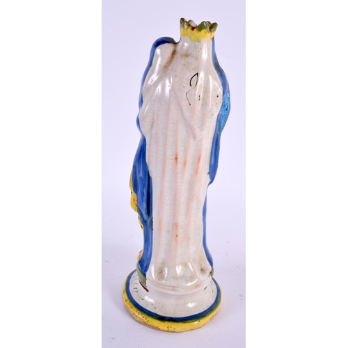 69 - A 19TH CENTURY FRENCH FAIENCE SAINT MARIE POTTERY FIGURE. 24 cm high.