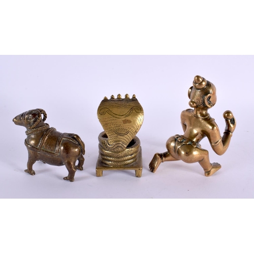 691 - THREE 18TH/19TH CENTURY MIDDLE EASTERN INDIAN BRONZE FIGURES. Largest 11 cm x 5 cm. (3)