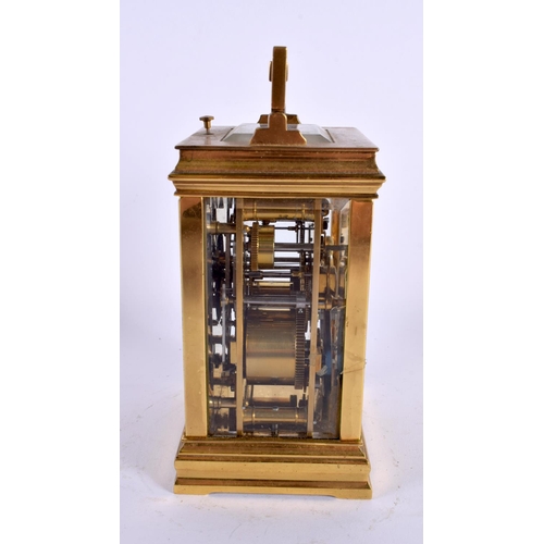 709 - AN ANTIQUE REPEATING TWIN DIAL CARRIAGE CLOCK. 18 cm high inc handle.