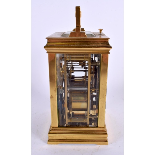 709 - AN ANTIQUE REPEATING TWIN DIAL CARRIAGE CLOCK. 18 cm high inc handle.