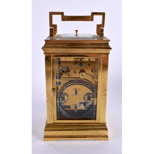 709 - AN ANTIQUE REPEATING TWIN DIAL CARRIAGE CLOCK. 18 cm high inc handle.