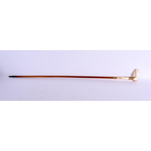 715 - A VICTORIAN YELLOW METAL MOUNTED MOTHER OF PEARL SWAGGER STICK. 74 cm long.