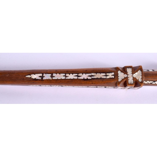 719 - AN UNUSUAL TRIBAL MOTHER OF PEARL INLAID HARDWOOD WALKING CANE possibly Ottoman. 90 cm long.