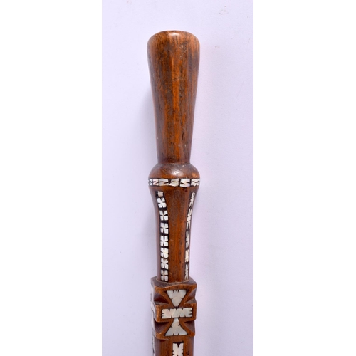 719 - AN UNUSUAL TRIBAL MOTHER OF PEARL INLAID HARDWOOD WALKING CANE possibly Ottoman. 90 cm long.