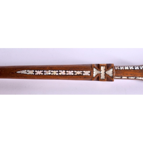 719 - AN UNUSUAL TRIBAL MOTHER OF PEARL INLAID HARDWOOD WALKING CANE possibly Ottoman. 90 cm long.