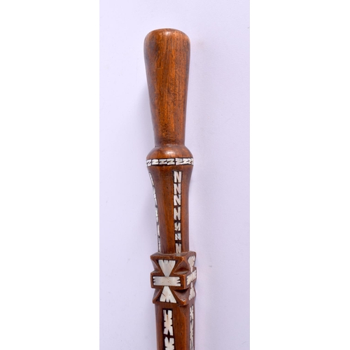 719 - AN UNUSUAL TRIBAL MOTHER OF PEARL INLAID HARDWOOD WALKING CANE possibly Ottoman. 90 cm long.