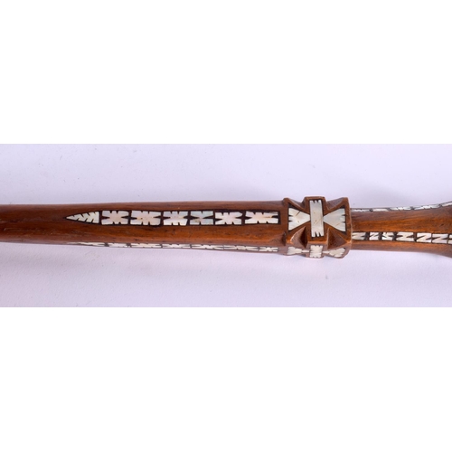 719 - AN UNUSUAL TRIBAL MOTHER OF PEARL INLAID HARDWOOD WALKING CANE possibly Ottoman. 90 cm long.