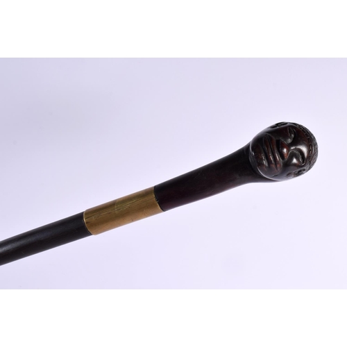 739 - AN UNUSUAL 19TH CENTURY TRIBAL DOUBLED HEADED WALKING CANE or possibly earlier and Continental. 90 c... 