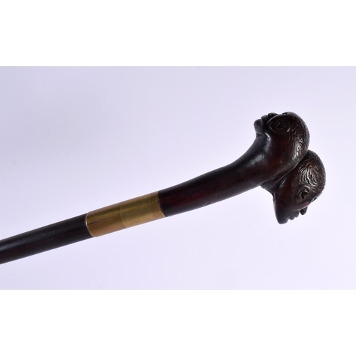 739 - AN UNUSUAL 19TH CENTURY TRIBAL DOUBLED HEADED WALKING CANE or possibly earlier and Continental. 90 c... 