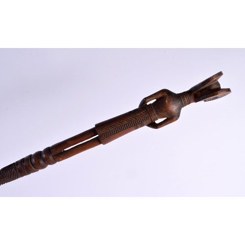 742 - AN EARLY 20TH CENTURY AFRICAN TRIBAL CARVED WOOD FERTILITY STAFF with bead work eyes. 95 cm long.