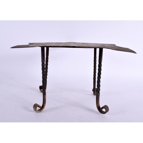 746 - AN 18TH CENTURY WROUGH IRON AND ENGRAVED BRASS STAND engraved all over with motifs. 22 cm x 18 cm.