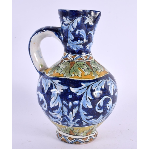 75 - AN ITALIAN FAIENCE TIN GLAZED POTTERY EWER. 16 cm x 6 cm.