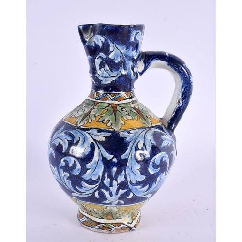 75 - AN ITALIAN FAIENCE TIN GLAZED POTTERY EWER. 16 cm x 6 cm.