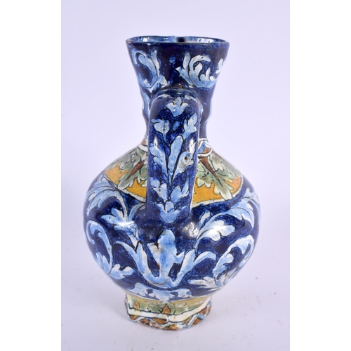 75 - AN ITALIAN FAIENCE TIN GLAZED POTTERY EWER. 16 cm x 6 cm.