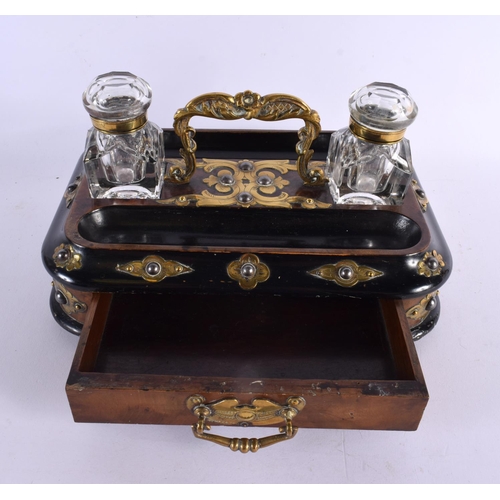 752 - A VICTORIAN EBONISED WALNUT INKSTAND with brass fittings, glass inkwell and drawer below. 24 cm x 16... 