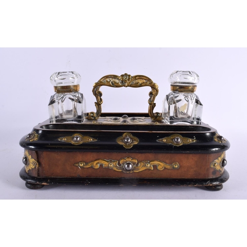 752 - A VICTORIAN EBONISED WALNUT INKSTAND with brass fittings, glass inkwell and drawer below. 24 cm x 16... 