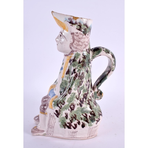 76 - AN 18TH/19TH CENTURY FRENCH FAIENCE TIN GLAZED TOBY JUG painted with flowers. 25 cm high.