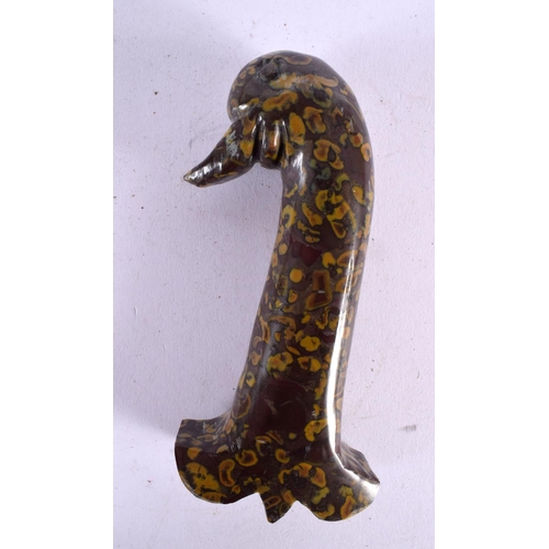 767 - A MIDDLE EASTERN MUGHAL TYPE CARVED PUDDINGSTONE AGATE DAGGER HANDLE with bird head terminal. 14 cm ... 