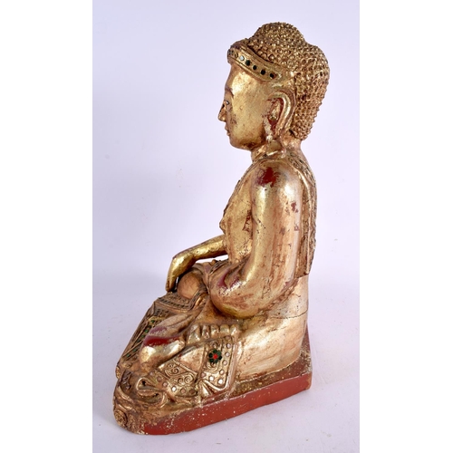 786 - AN INDIAN ASIAN CARVED POLYCHROMED WOOD FIGURE OF A BUDDHA. 32 cm x 18 cm.