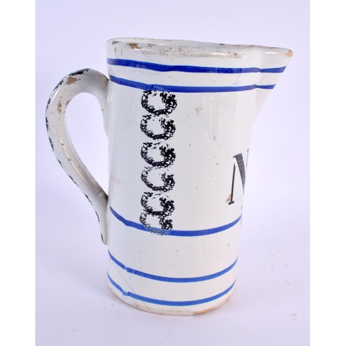 79 - AN ANTIQUE FRENCH SPONGEWARE POTTERY MEASURING JUG. 18 cm x 12 cm.