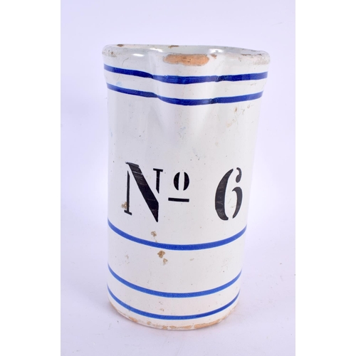 79 - AN ANTIQUE FRENCH SPONGEWARE POTTERY MEASURING JUG. 18 cm x 12 cm.