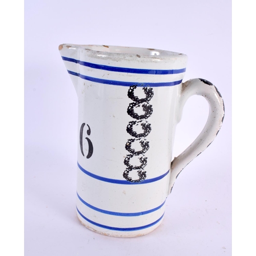 79 - AN ANTIQUE FRENCH SPONGEWARE POTTERY MEASURING JUG. 18 cm x 12 cm.