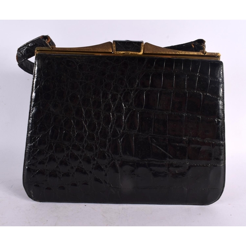 793 - THREE VINTAGE CROCODILE SKIN BAGS. Largest 32 cm x 22 cm. (3)