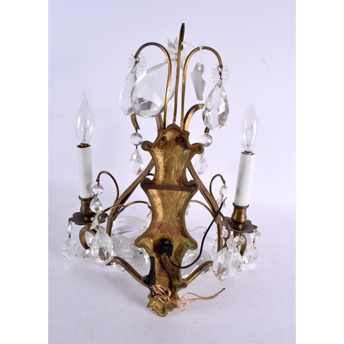 795 - THREE BRASS WALL SCONCES and another. Largest 35 cm x 25 cm. (4)