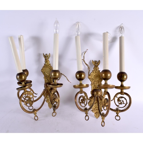 795 - THREE BRASS WALL SCONCES and another. Largest 35 cm x 25 cm. (4)