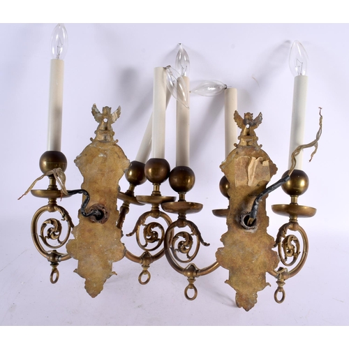 795 - THREE BRASS WALL SCONCES and another. Largest 35 cm x 25 cm. (4)