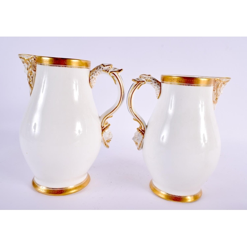 85 - A GRADUATED SET OF THREE 19TH CENTURY ENGLISH PORCELAIN JUGS. Largest 20 cm x 12 cm. (3)