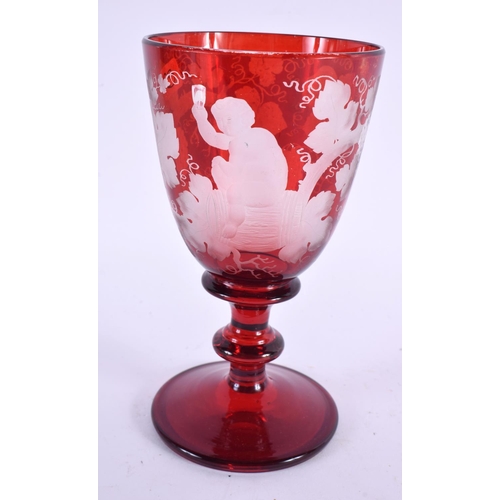 86 - A 19TH CENTURY BOHEMIAN RUBY GLASS BACCHUS GOBLET. 16 cm high.