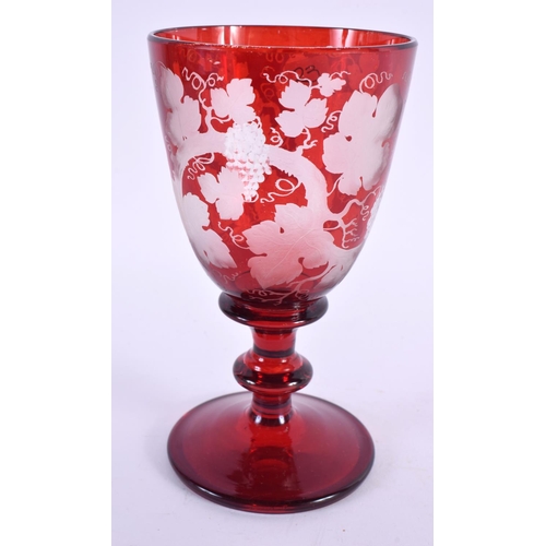 86 - A 19TH CENTURY BOHEMIAN RUBY GLASS BACCHUS GOBLET. 16 cm high.