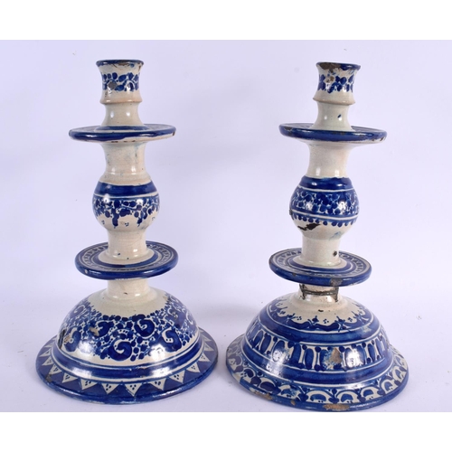 94 - A PAIR OF 19TH CENTURY FRENCH FAIENCE TIN GLAZED CANDLESTICKS. 30 cm high.