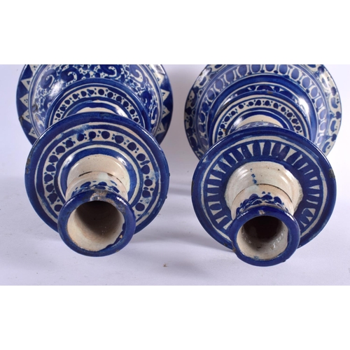 94 - A PAIR OF 19TH CENTURY FRENCH FAIENCE TIN GLAZED CANDLESTICKS. 30 cm high.