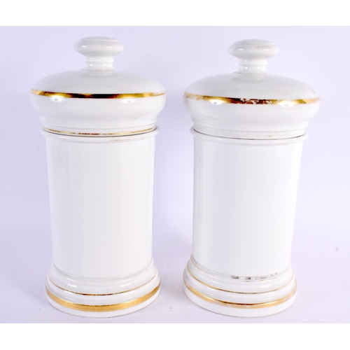 96 - A LARGE PAIR OF ANTIQUE PORCELAIN APOTHECARY JARS. 27 cm x 11 cm.