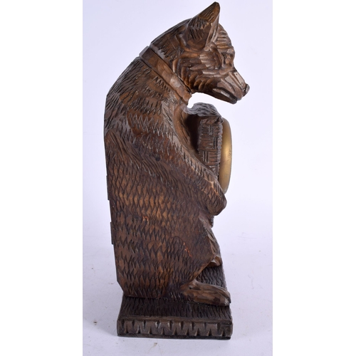 480 - A CONTEMPORARY BLACK FOREST CARVED WOOD WOLF CLOCK. 32 cm x 12 cm.