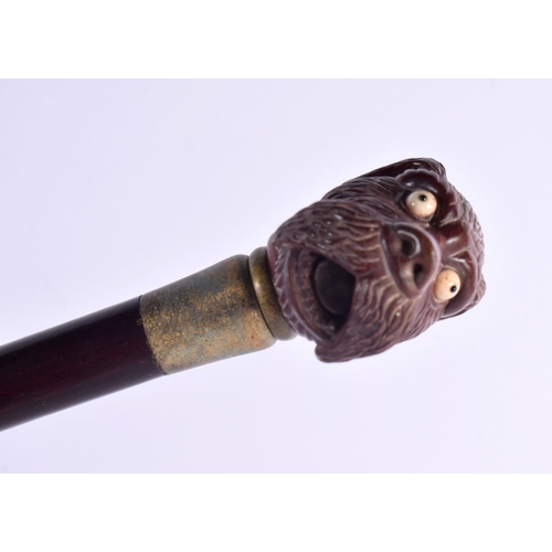 482 - A CONTEMPORARY CARVED WOOD DOG WALKING CANE. 90 cm long.