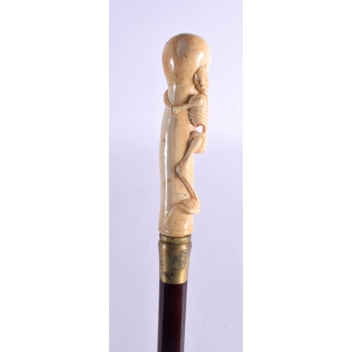 486 - A CONTEMPORARY CARVED BONE SKELTETON WALKING CANE 90 cm long.