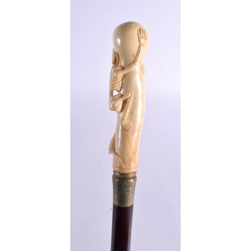 486 - A CONTEMPORARY CARVED BONE SKELTETON WALKING CANE 90 cm long.