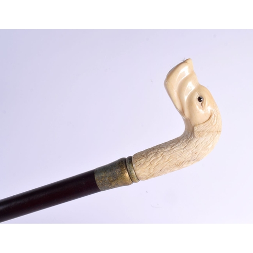 487 - A CONTEMPORARY CARVED BONE DOG WALKING CANE 90 cm long.