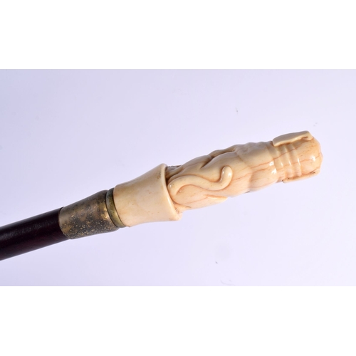 489 - A CONTEMPORARY CARVED BONE BUDDHISTIC LION WALKING CANE 90 cm long.