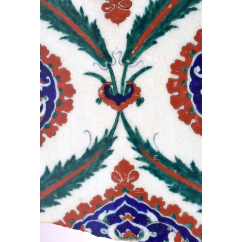 474 - A LARGE TURKISH MIDDLE EASTERN IZNIK TILE painted with flowers. 34 cm x 24 cm.