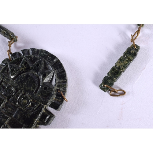 1003 - A VINTAGE SOUTH AMERICAN TRIBAL CARVED STONE NECKLACE. 73 cm long, pendant 9.25 cm x 4.25 cm.