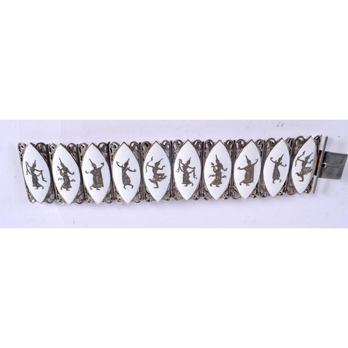 1007 - A SOUTH EAST ASIAN SILVER AND ENAMEL BRACELET. 76 grams. 18 cm x 4 cm.