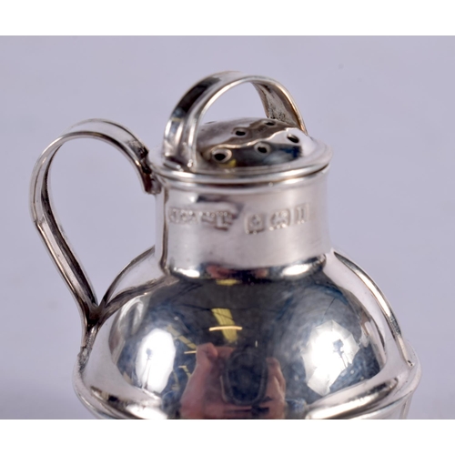 1015 - A NOVELTY EDWARDIAN SILVER MILK JUG PEPPER POT. 9.4 grams. Birmingham 1912. 4.5 cm x 3.5 cm.